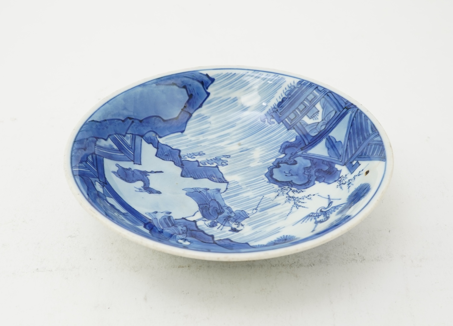 A Chinese blue and white saucer dish, Kangxi six character mark and of the period (1662-1722)